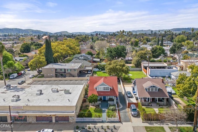 birds eye view of property featuring a mountain view