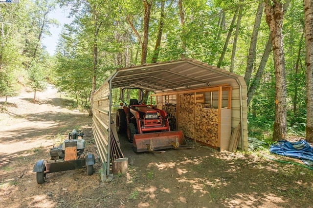 view of parking / parking lot featuring a carport