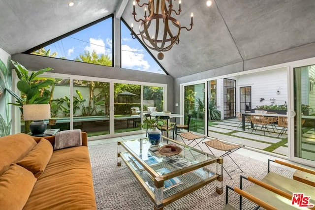 sunroom featuring a notable chandelier