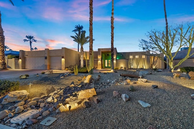 southwest-style home with a garage