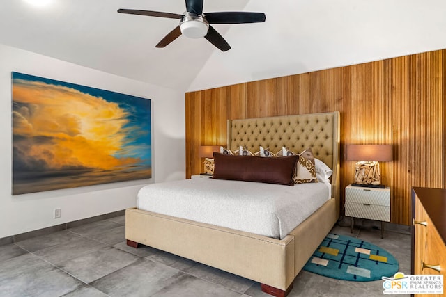 bedroom with ceiling fan, wood walls, and lofted ceiling