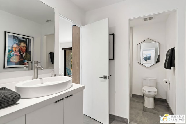 bathroom with vanity and toilet