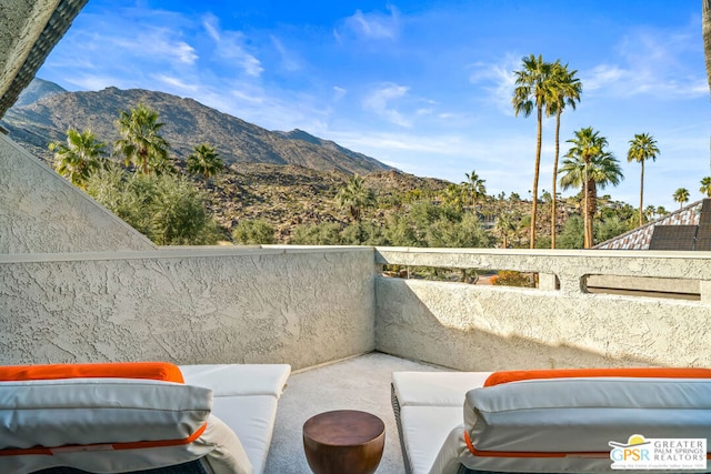 balcony featuring a mountain view