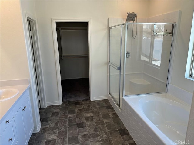 bathroom with vanity and plus walk in shower