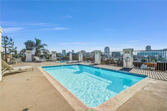 view of swimming pool featuring a patio