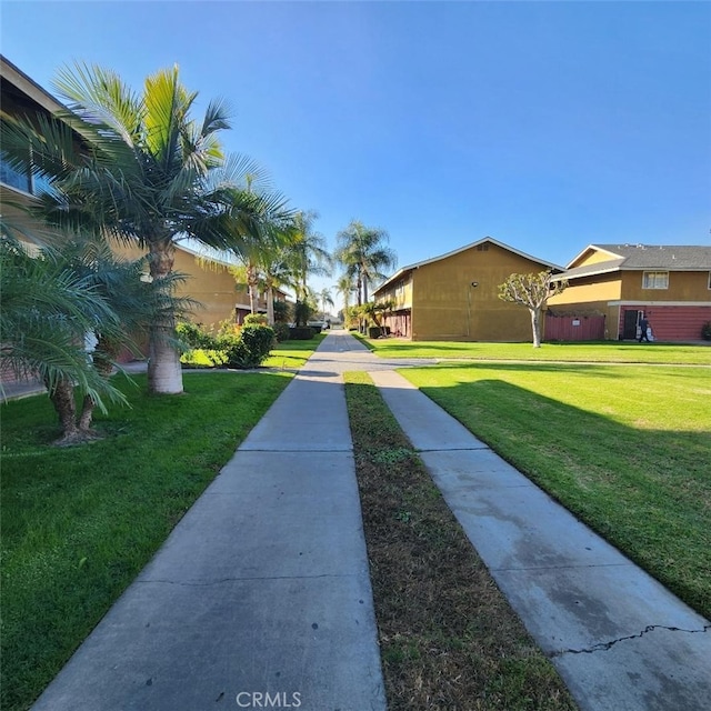 view of property's community featuring a lawn