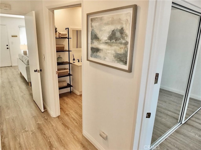 hallway featuring light hardwood / wood-style flooring