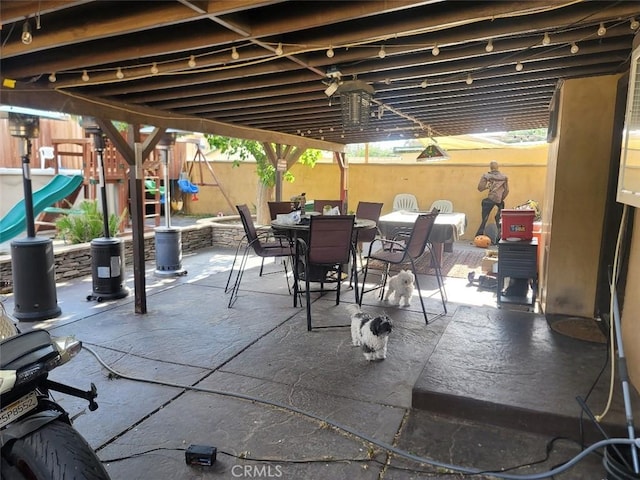 view of patio featuring a playground