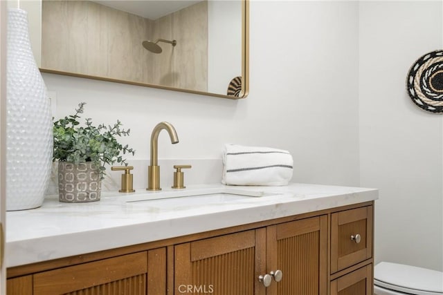 bathroom with toilet and vanity