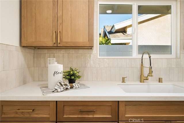 kitchen featuring sink and backsplash