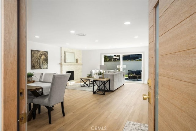 interior space featuring a fireplace and light wood-type flooring