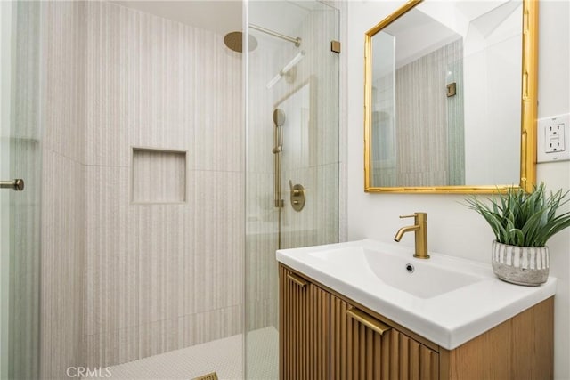 bathroom with vanity and a shower