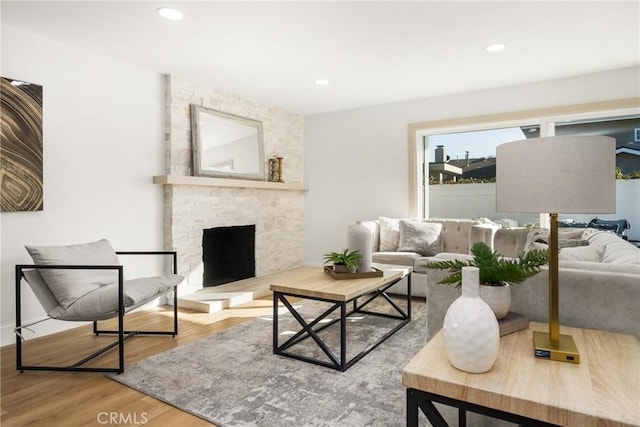 living room featuring hardwood / wood-style flooring and a fireplace