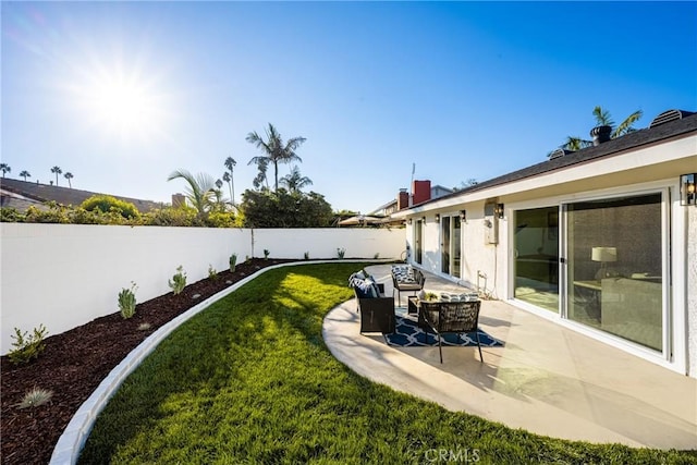 view of yard featuring a patio and a fenced backyard