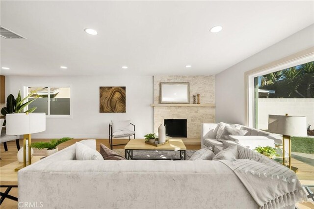 living room featuring hardwood / wood-style floors and a fireplace