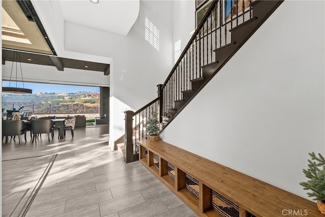 staircase with a high ceiling