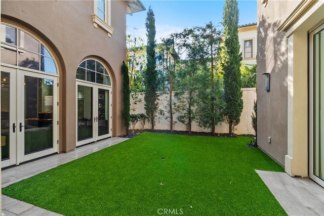 view of yard with french doors