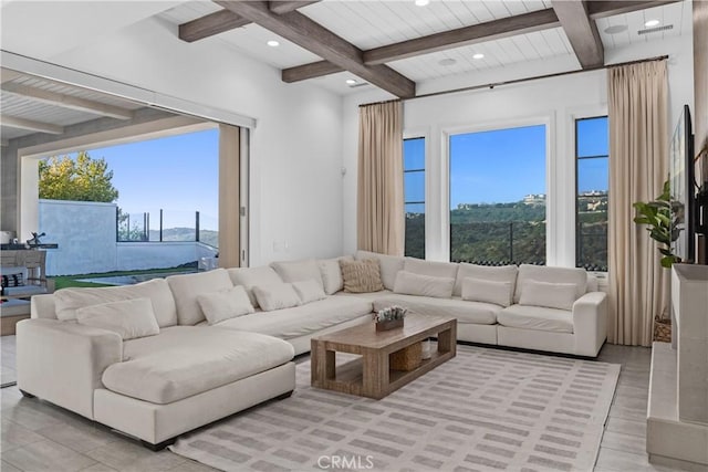 living room featuring beamed ceiling and wooden ceiling