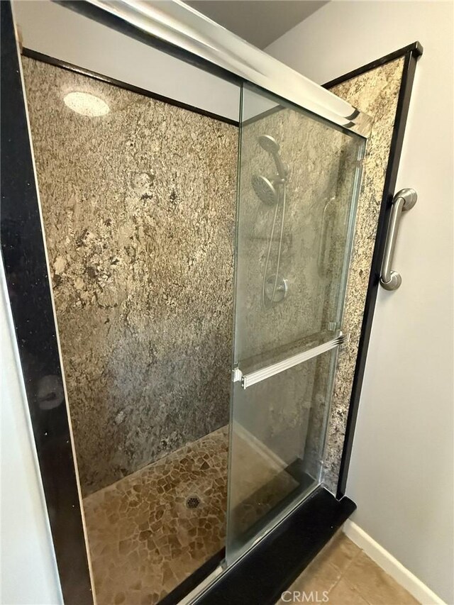 35777 Rd 606, Raymond, CA 93653 - full bath featuring a stall shower, tile patterned flooring, and baseboards