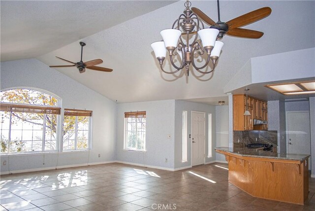 35777 Rd 606, Raymond, CA 93653 - kitchen with high vaulted ceiling, a ceiling fan, tile patterned flooring, a peninsula, and a chandelier