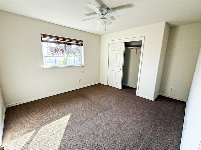 35777 Rd 606, Raymond, CA 93653 - unfurnished bedroom with dark carpet, a closet, baseboards, and ceiling fan
