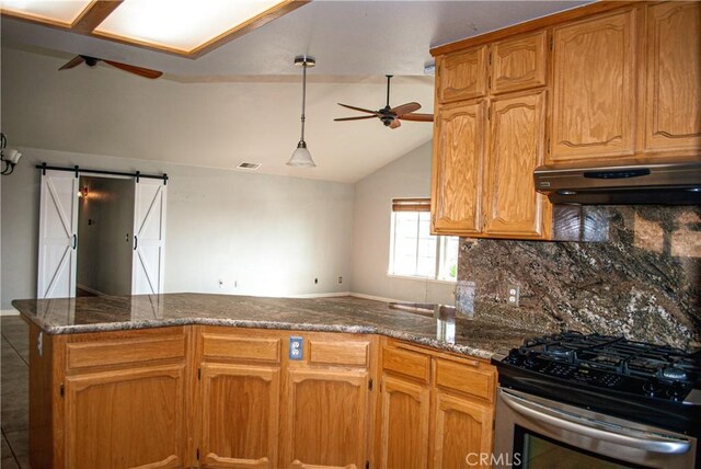 35777 Rd 606, Raymond, CA 93653 - kitchen with ceiling fan, under cabinet range hood, gas stove, a peninsula, and vaulted ceiling