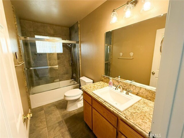 35777 Rd 606, Raymond, CA 93653 - full bath featuring toilet, vanity, and combined bath / shower with glass door