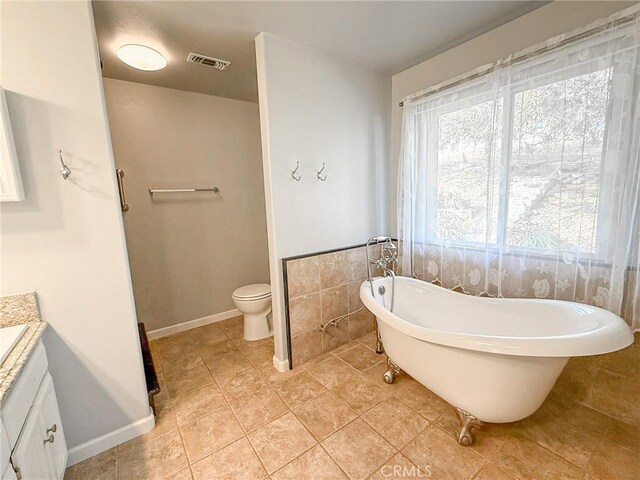 35777 Rd 606, Raymond, CA 93653 - full bath with vanity, a soaking tub, tile patterned floors, toilet, and baseboards