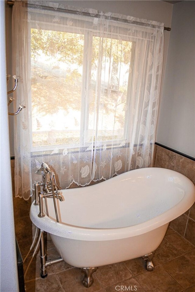 35777 Rd 606, Raymond, CA 93653 - bathroom featuring a freestanding bath and tile patterned flooring