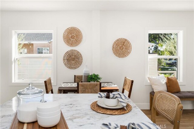 dining area featuring hardwood / wood-style flooring