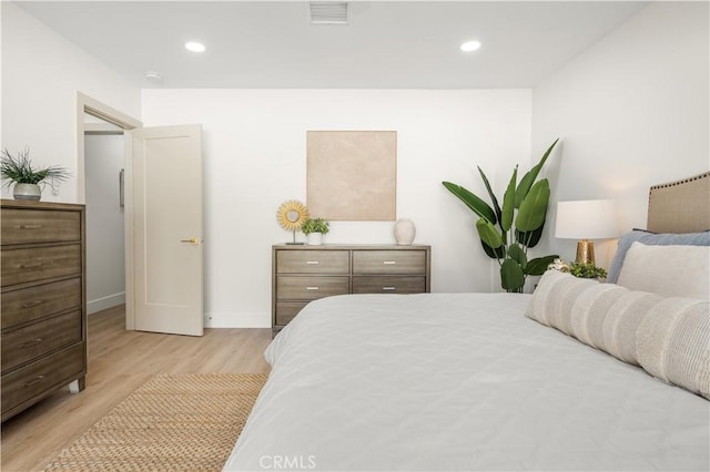 bedroom with light hardwood / wood-style flooring