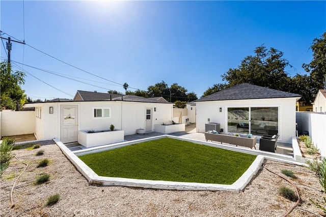 rear view of property featuring central air condition unit, outdoor lounge area, a fenced backyard, and stucco siding