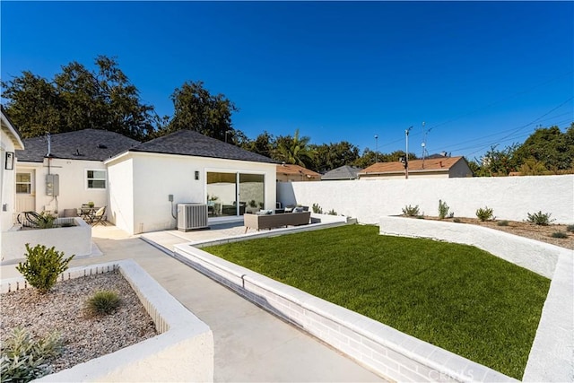 view of yard featuring an outdoor living space, a patio, and central air condition unit