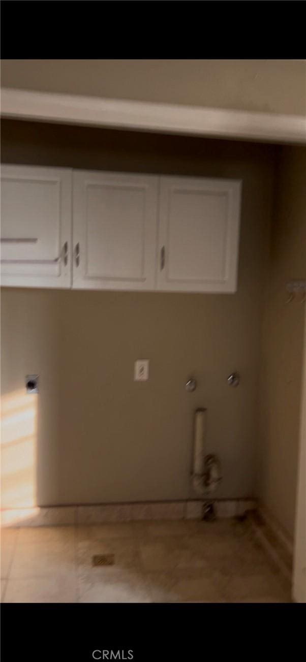 laundry room with cabinets