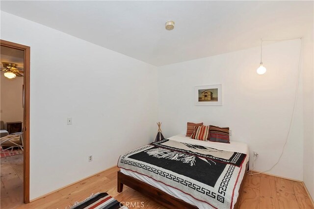 bedroom featuring wood-type flooring