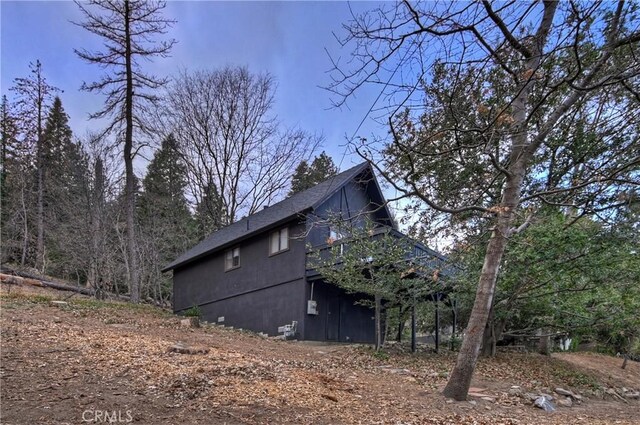 view of property exterior with a deck