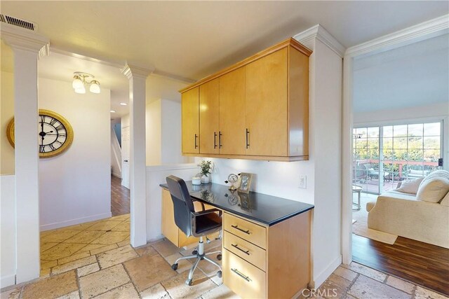 office area featuring ornamental molding and ornate columns