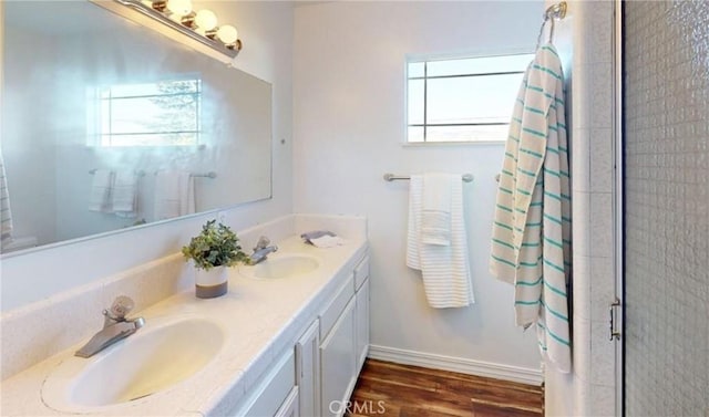 bathroom with vanity, a shower with shower curtain, wood-type flooring, and a wealth of natural light