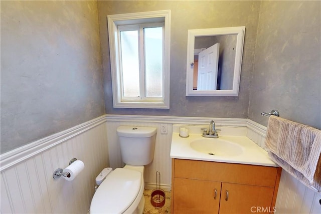 bathroom featuring toilet and vanity