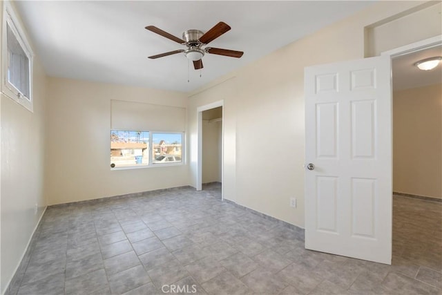 spare room with ceiling fan