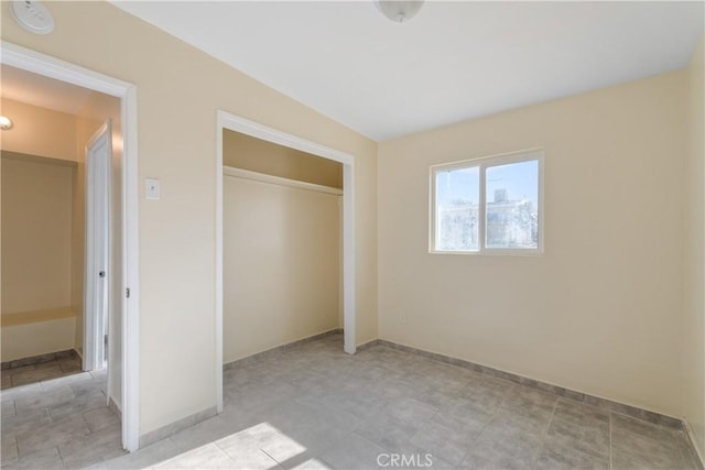 unfurnished bedroom with a closet