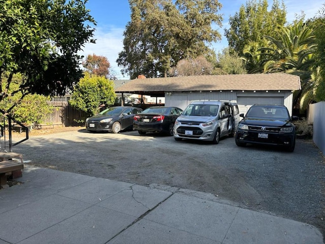 view of car parking with a garage