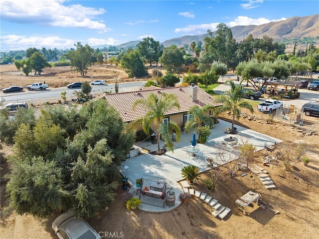 birds eye view of property with a mountain view