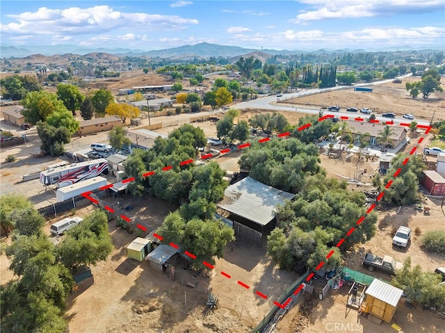 birds eye view of property with a mountain view