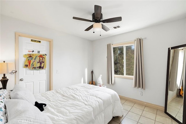 bedroom featuring ceiling fan and light tile patterned floors