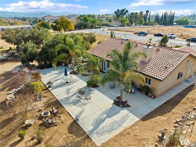 birds eye view of property with a mountain view