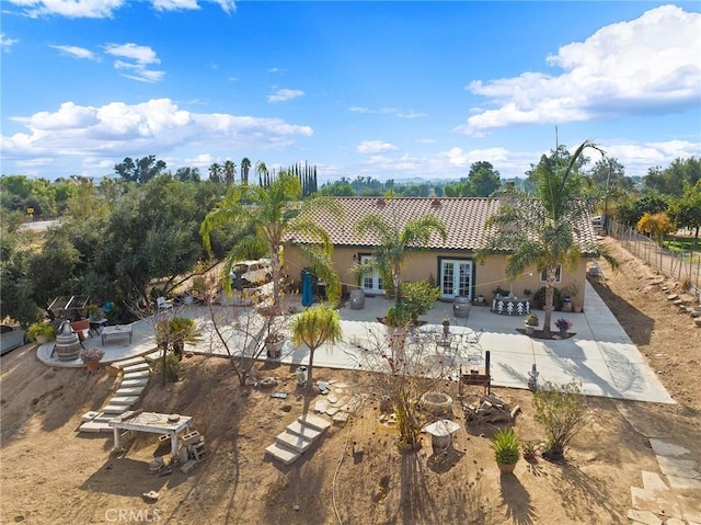 back of house with french doors and a patio area