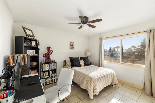 bedroom featuring ceiling fan and light tile patterned floors