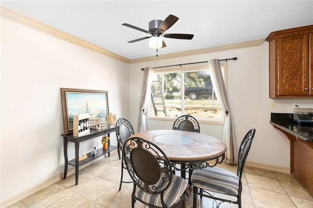 dining area featuring light tile patterned floors, ceiling fan, and crown molding