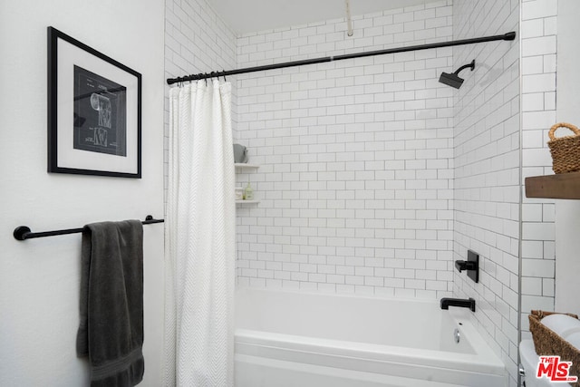 bathroom with shower / bath combination with curtain